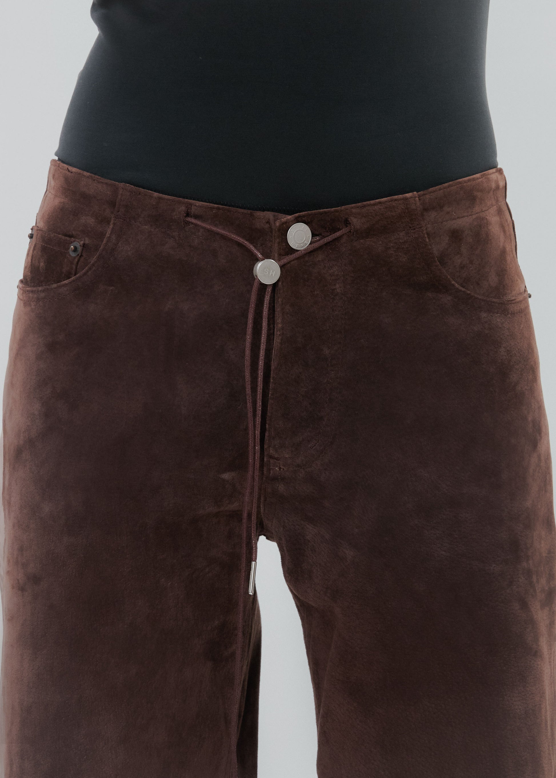 Brown pants with a plain background