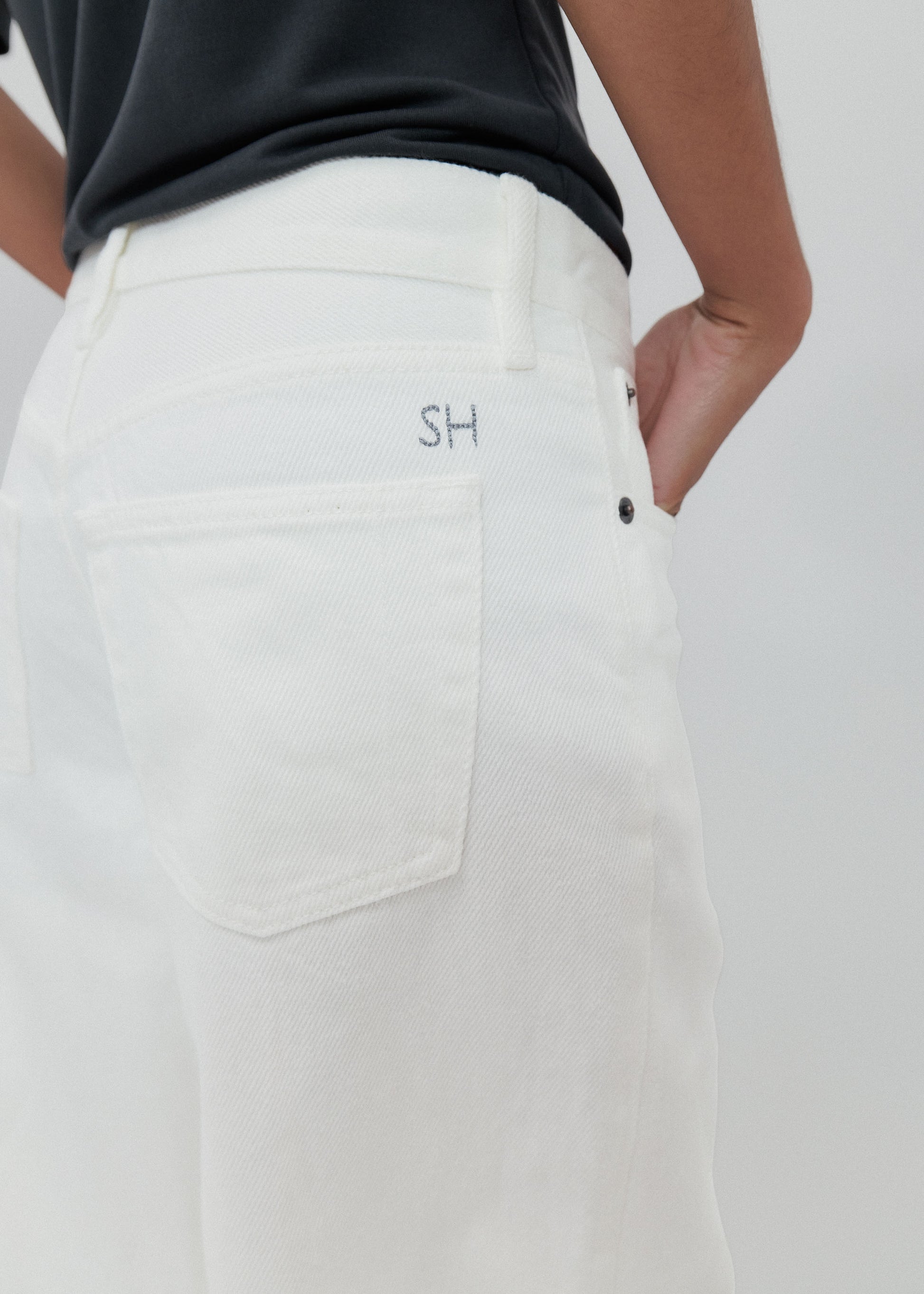 White pants with a logo on a white background