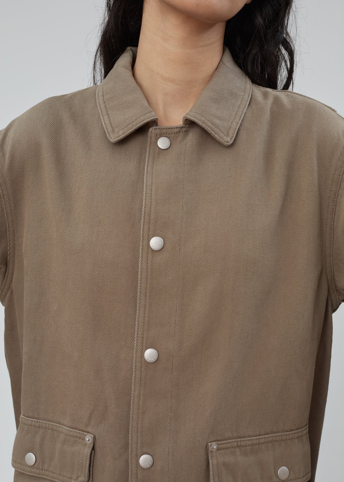 Barn Jacket in Army Green olive cotton denim with a collar and silver metal snap buttons.