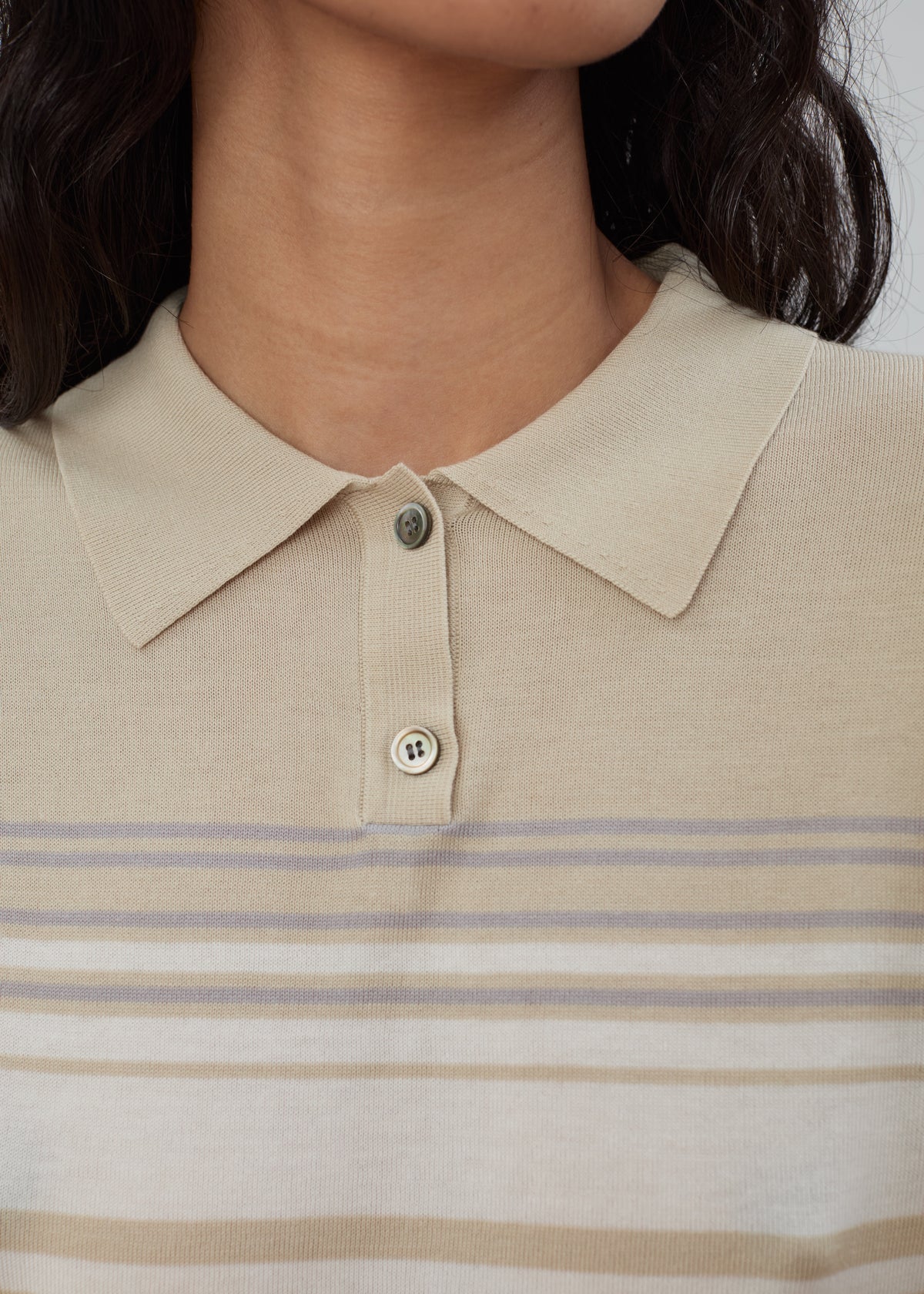 Daughter Sweater Long Sleeve in Beige Stripe, a long-sleeve Tencel sweater featuring a two-button placket and horizontal stripes in white, grey, and tan.