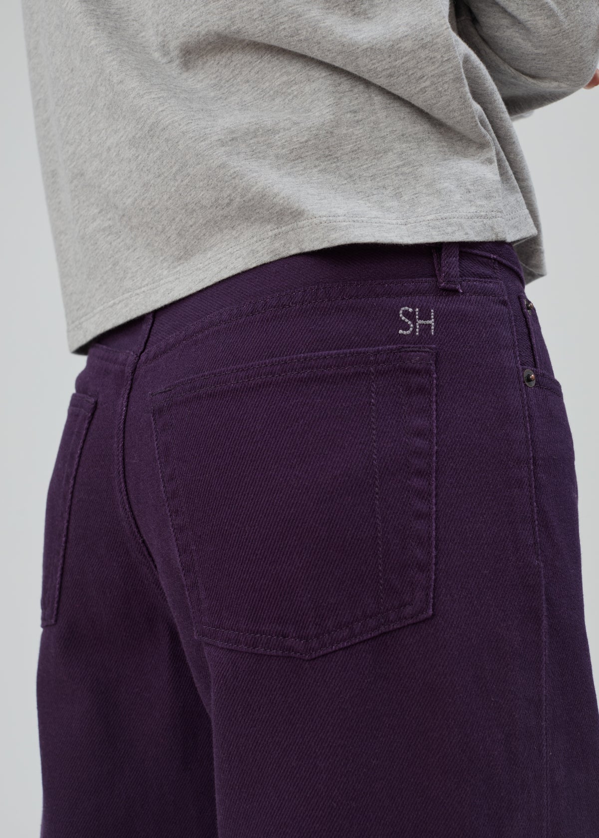 Everyday Jean in Purple: mid-rise jeans with a relaxed leg, featuring a small SH logo embroidered above the back pocket.